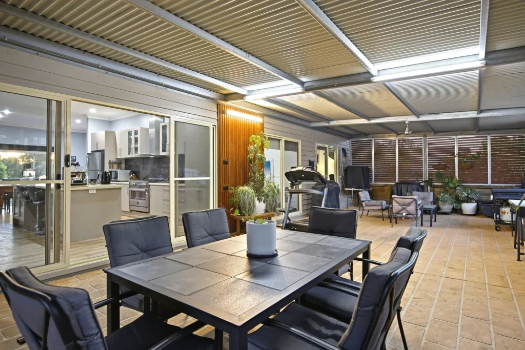 Large covered outdoor entertaining area overlooking the gardens.