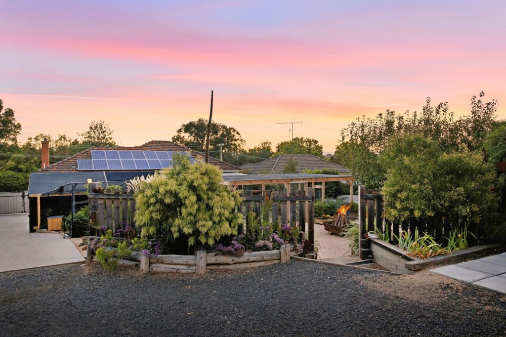Established gardens and outdoor entertaining spaces at 27 Raglan Street, Yea.